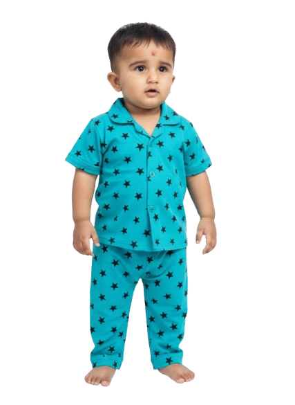 Toddler in blue star print cotton pajamas, standing barefoot, kids clothing